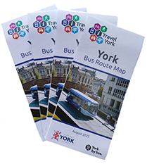 A pile of York bus route map leaflets